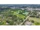 Lovely aerial perspective showcasing the home's location surrounded by trees, nature and city amenities at 715 W 109Th Ave, Tampa, FL 33612