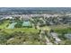 Enjoy this stunning aerial view of the property's surrounding community, green spaces, and nearby amenities at 715 W 109Th Ave, Tampa, FL 33612