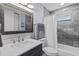Updated bathroom with marble tile, modern vanity, and a shower-tub combo at 715 W 109Th Ave, Tampa, FL 33612