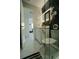 Updated bathroom with glass enclosed shower, marble floors, and updated fixtures at 7510 N Tampania Ave, Tampa, FL 33614