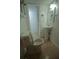 This bathroom features a toilet, sink, and mirror, providing essential functionality for the home at 7510 N Tampania Ave, Tampa, FL 33614