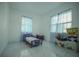 Cozy bedroom with playful decor, bright windows, and tiled flooring at 7510 N Tampania Ave, Tampa, FL 33614