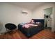 The bedroom includes a bed, a chair, and a view into the bathroom at 7510 N Tampania Ave, Tampa, FL 33614