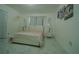 Bright bedroom featuring a stylish bed, marble floors and modern decor accents at 7510 N Tampania Ave, Tampa, FL 33614