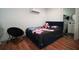 The bedroom includes a bed, a chair, and a view into the bathroom at 7510 N Tampania Ave, Tampa, FL 33614