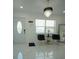 Modern entryway featuring elegant tile flooring, stylish lighting, and welcoming decor at 7510 N Tampania Ave, Tampa, FL 33614