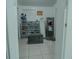 The hallway is spacious with storage for shoes and other items at 7510 N Tampania Ave, Tampa, FL 33614