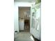 This laundry room offers convenience with its washing machine and organized space for laundry tasks at 7510 N Tampania Ave, Tampa, FL 33614