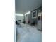 The patio includes chairs, a refrigerator, and a cooktop, creating a comfortable outdoor living space at 7510 N Tampania Ave, Tampa, FL 33614