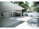 Spacious covered patio with tile flooring, perfect for entertaining and outdoor relaxation at 7510 N Tampania Ave, Tampa, FL 33614