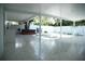 Expansive covered patio with tiled flooring, offering ample outdoor living space at 7510 N Tampania Ave, Tampa, FL 33614