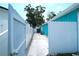View of side yard showing fenced access to backyard at 7510 N Tampania Ave, Tampa, FL 33614