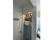 Linen closet with neatly organized towels and decorative lighting at 800 Bayway Blvd # 14, Clearwater Beach, FL 33767