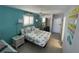Comfortable bedroom featuring beach themed bedding, decor, and wicker furnishings at 800 Bayway Blvd # 14, Clearwater Beach, FL 33767