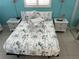 Inviting bedroom featuring beach themed decor and tropical themed bedding at 800 Bayway Blvd # 14, Clearwater Beach, FL 33767