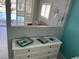 View from the bedroom into the living room, and out to the sparkling pool at 800 Bayway Blvd # 14, Clearwater Beach, FL 33767