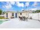 Backyard featuring a pool, patio, dining area, and privacy fence at 821 52Nd S Ave, St Petersburg, FL 33705