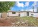 Backyard with patio, pool, privacy fence, storage shed, and lush lawn at 821 52Nd S Ave, St Petersburg, FL 33705