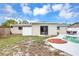 Backyard oasis with patio, pool, privacy fence, and storage shed at 821 52Nd S Ave, St Petersburg, FL 33705