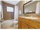 Bathroom featuring a vanity, a bathtub with shower, and neutral toned tile at 821 52Nd S Ave, St Petersburg, FL 33705