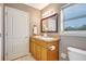Well-lit bathroom with a double sink vanity, modern fixtures, and a framed mirror at 821 52Nd S Ave, St Petersburg, FL 33705