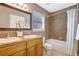 Bathroom featuring a double sink vanity, tiled floors, and bathtub with shower at 821 52Nd S Ave, St Petersburg, FL 33705