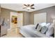 Well-lit bedroom with a ceiling fan, closet, and a view into the kitchen area at 821 52Nd S Ave, St Petersburg, FL 33705