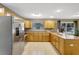 Spacious kitchen with stainless steel appliances, ample counter space, and wooden cabinetry at 821 52Nd S Ave, St Petersburg, FL 33705