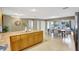 Open kitchen with stainless steel appliances, a large island, and a seamless flow into the living areas at 821 52Nd S Ave, St Petersburg, FL 33705
