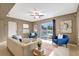 Comfortable living room with sliding glass doors overlooking the backyard swimming pool at 821 52Nd S Ave, St Petersburg, FL 33705