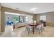 Spacious living room with dining area, tile floors, and sliding glass doors to the backyard at 821 52Nd S Ave, St Petersburg, FL 33705