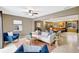 Inviting living room with neutral decor, comfortable seating, and an open layout into the kitchen at 821 52Nd S Ave, St Petersburg, FL 33705