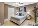 Comfortable bedroom featuring tile floors, a ceiling fan and large window at 821 52Nd S Ave, St Petersburg, FL 33705