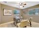 Inviting home office space with a desk, seating, and natural light from two windows at 821 52Nd S Ave, St Petersburg, FL 33705