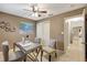 Bright office space featuring a ceiling fan, a window, seating for two, and closet space at 821 52Nd S Ave, St Petersburg, FL 33705