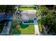 Aerial view of a well-maintained home with lush landscaping and a paved driveway at 8444 15Th N Way, St Petersburg, FL 33702