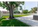 Expansive backyard features a paver patio, lush lawn, privacy fence and mature tree providing shade at 8444 15Th N Way, St Petersburg, FL 33702