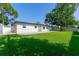 Spacious backyard featuring a lush lawn and patio at 8444 15Th N Way, St Petersburg, FL 33702