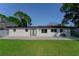 Backyard featuring a lush lawn and patio, great for relaxing or entertaining at 8444 15Th N Way, St Petersburg, FL 33702