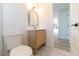 Bathroom features vanity with gold accents and unique tiled flooring at 8444 15Th N Way, St Petersburg, FL 33702