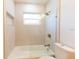 Bathroom with tile tub and shower, recessed lighting, and gold fixtures at 8444 15Th N Way, St Petersburg, FL 33702