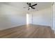 Bright bedroom with light wood floors, ceiling fan, and white trim at 8444 15Th N Way, St Petersburg, FL 33702