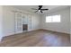 Bedroom featuring light wood floors, modern sliding doors, and ample natural light at 8444 15Th N Way, St Petersburg, FL 33702