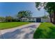 Charming home with manicured front yard, paver driveway, and inviting curb appeal at 8444 15Th N Way, St Petersburg, FL 33702