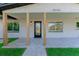 Inviting front porch with modern columns and new landscaping at 8444 15Th N Way, St Petersburg, FL 33702