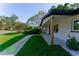 Charming home with manicured front yard, walkway, and inviting entrance at 8444 15Th N Way, St Petersburg, FL 33702