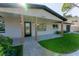 Charming home with a landscaped front yard and covered porch at 8444 15Th N Way, St Petersburg, FL 33702