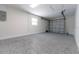Spacious garage boasts epoxy floors and a modern overhead door, perfect for parking and storage at 8444 15Th N Way, St Petersburg, FL 33702