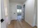 Hallway area features light wood floors and access to bedrooms and other rooms at 8444 15Th N Way, St Petersburg, FL 33702