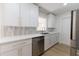 Bright kitchen featuring white cabinets, stainless steel appliances and quartz countertops at 8444 15Th N Way, St Petersburg, FL 33702